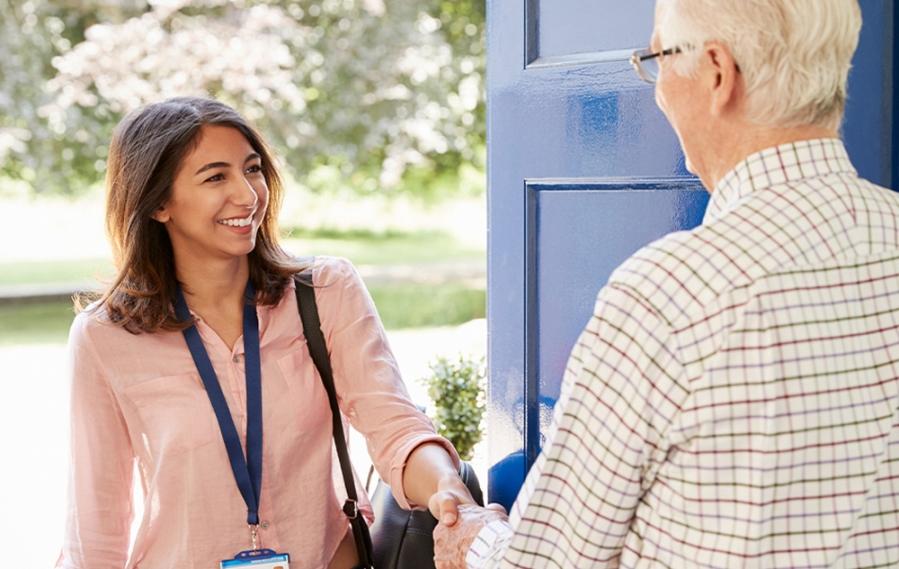 An MSCP student shakes hands with a client